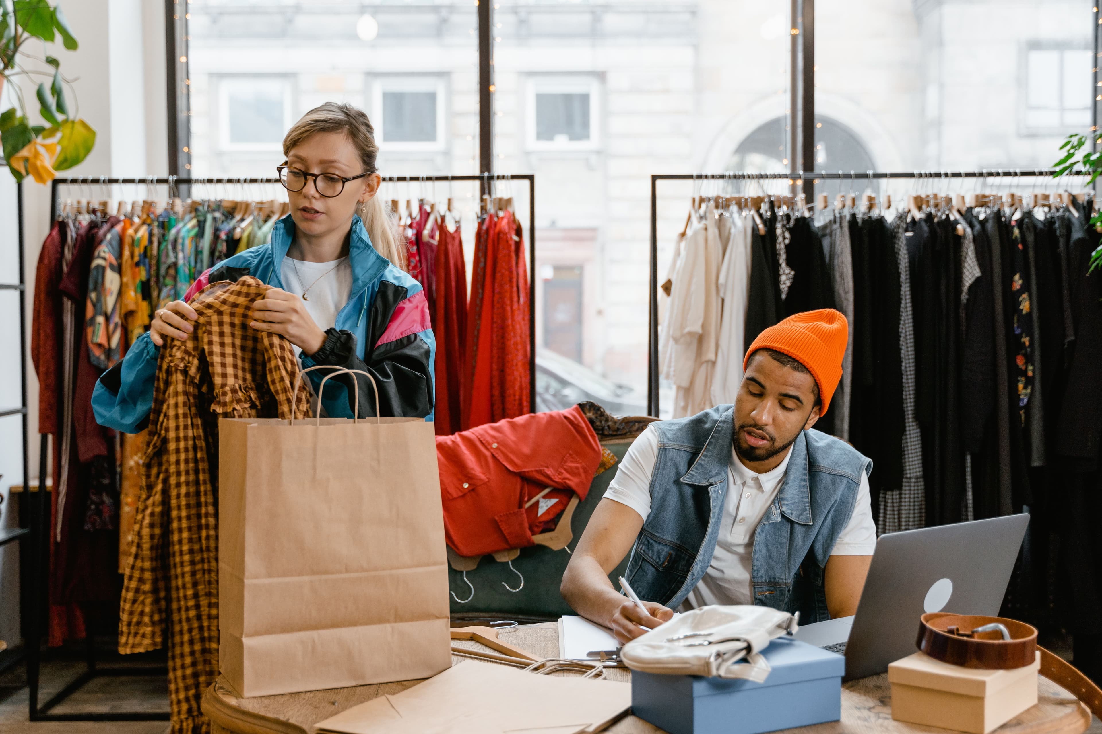Two retail employees at work
