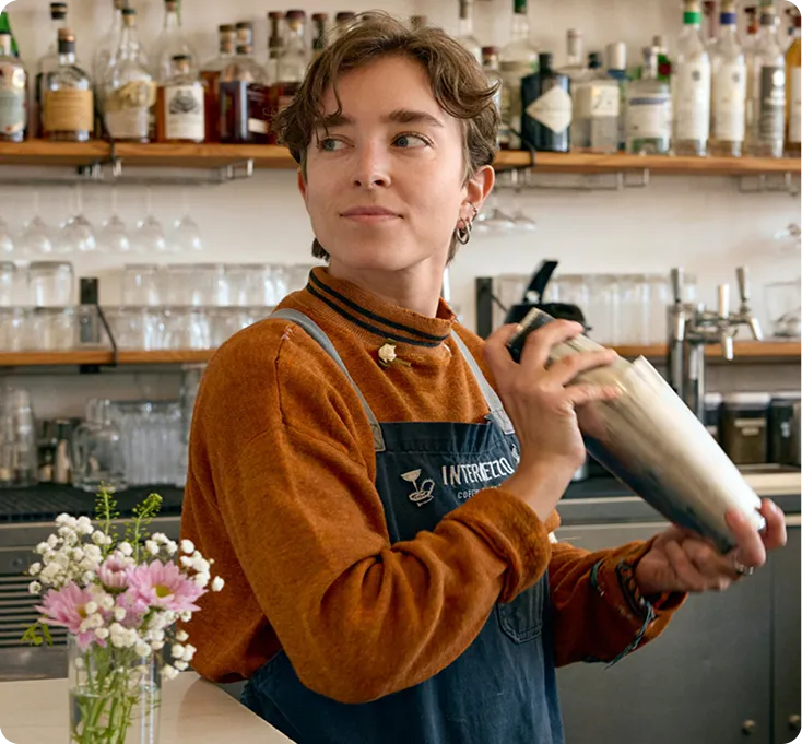 Bartender shaking a cocktail at a cocktail bar