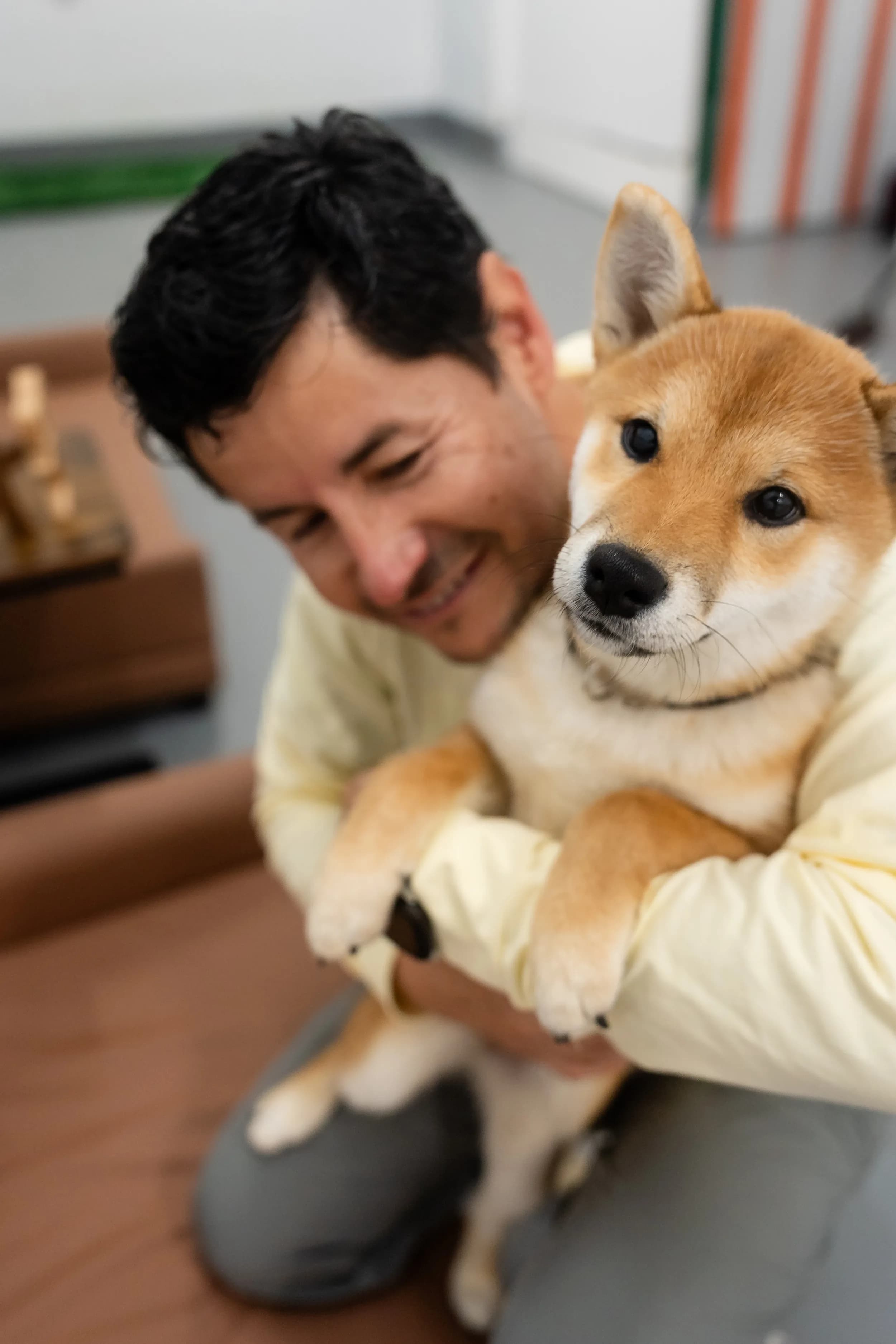 Roberto Bustillos with a dog at Lombard Doggy Daycare.