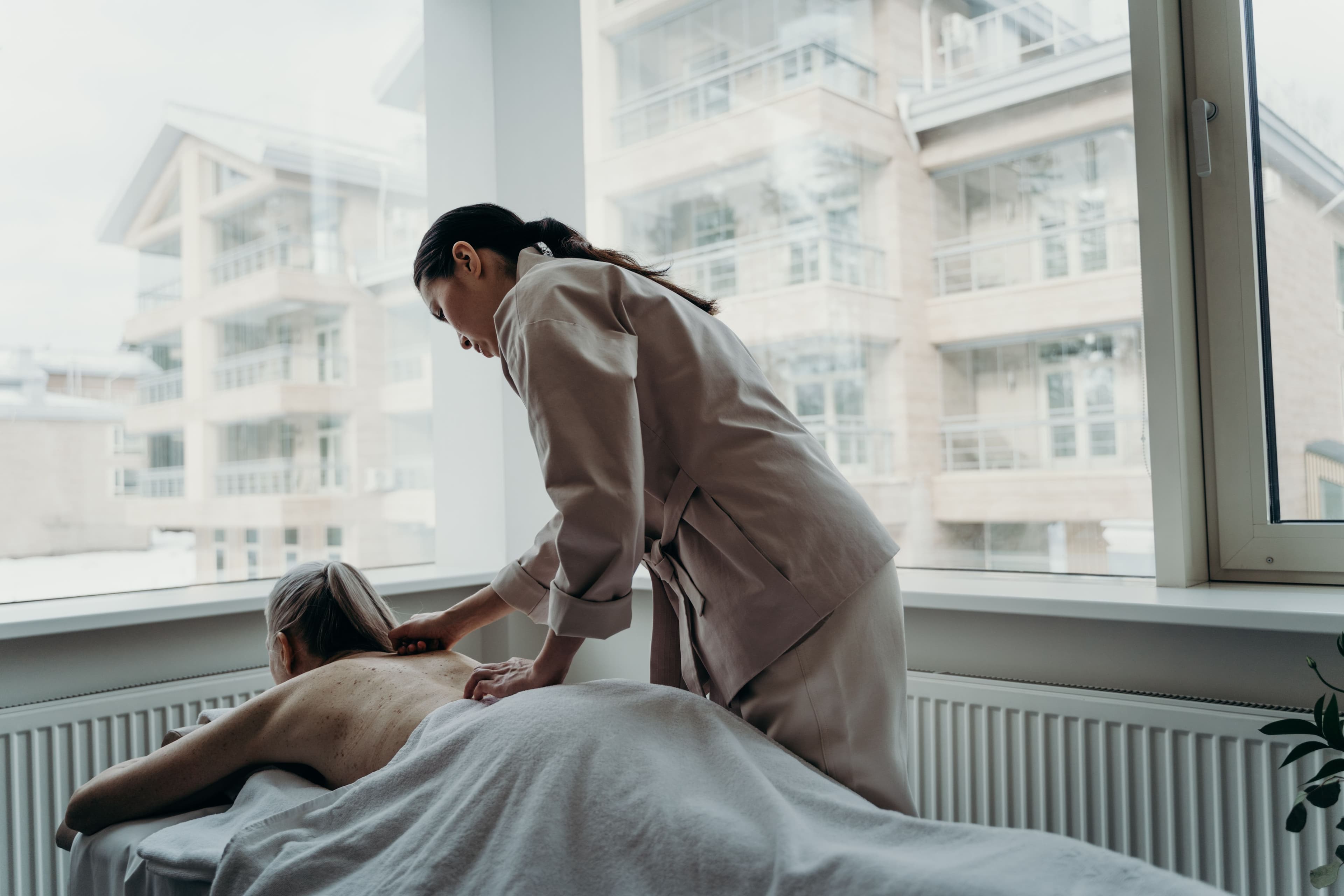 A massage therapist and a client.