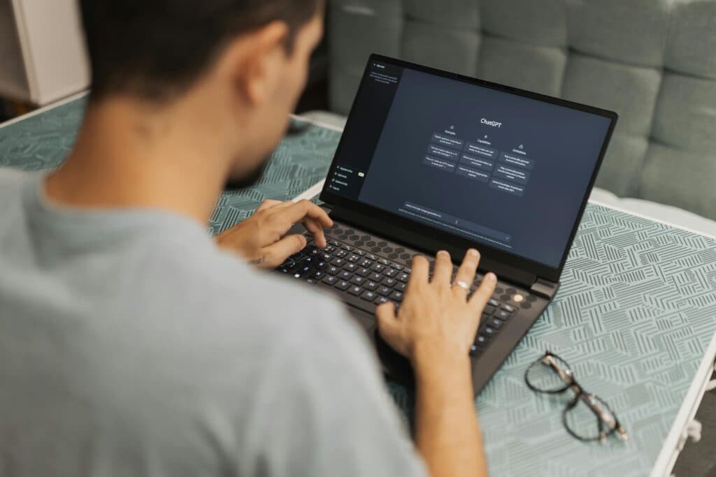 Employee using ChatGPT on his laptop